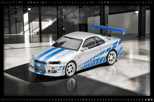NISSAN SKYLINE GT-R (R34) C- WEST - 2 FAST 2 FURIOUS - BRIAN O'CONNER 2003 ‼️ENKEL IN BLISTERVERPAKKING‼️ MINI GT 1:64