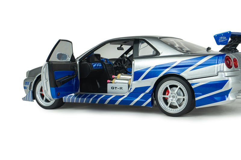 Load image into Gallery viewer, NISSAN SKYLINE GT-R (BNR34) 2FAST2FURIOUS BRIAN SOLIDO 1:18
